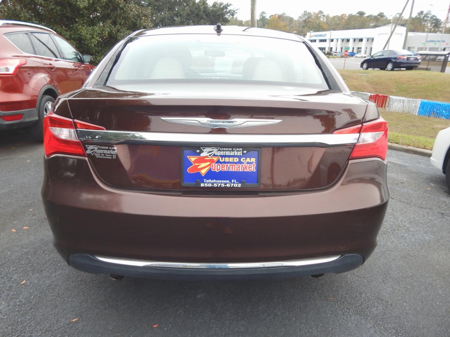 2013 Burgundy /Tan Leather Chrysler 200 Limited (1C3CCBCG3DN) with an 3.6L 6 Cyl. engine, Automatic transmission, located at 3120 W Tennessee St, Tallahassee, FL, 32304-1002, (850) 575-6702, 30.458841, -84.349648 - Used Car Supermarket is proud to present you with this loaded immaculate 2013 Chrysler 200 Limited with leather, sunroof and low miles. Used Car Supermarket prides itself in offering you the finest pre-owned vehicle in Tallahassee. Used Car Supermarket has been locally family owned and operated for - Photo#3